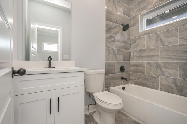 full bathroom with tiled shower / bath combo, vanity, and toilet