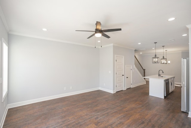 unfurnished living room with sink, ornamental molding, dark hardwood / wood-style floors, and ceiling fan