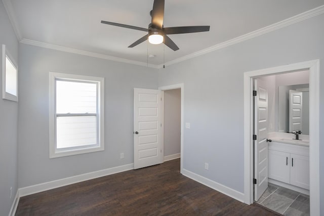 unfurnished bedroom with dark wood-type flooring, connected bathroom, sink, ornamental molding, and ceiling fan