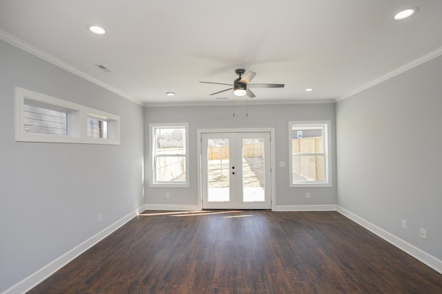 unfurnished room featuring crown molding, dark wood-type flooring, french doors, and ceiling fan