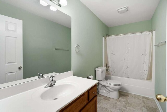 full bathroom with vanity, toilet, and shower / bath combo