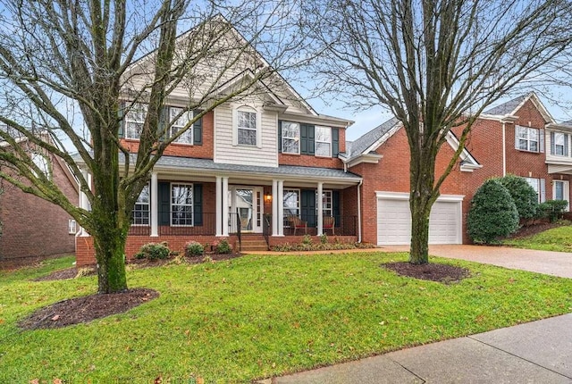 view of front facade with a garage, a front yard, and covered porch