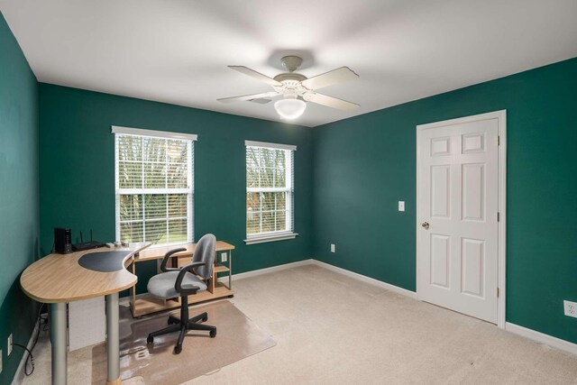 office area with light colored carpet and ceiling fan