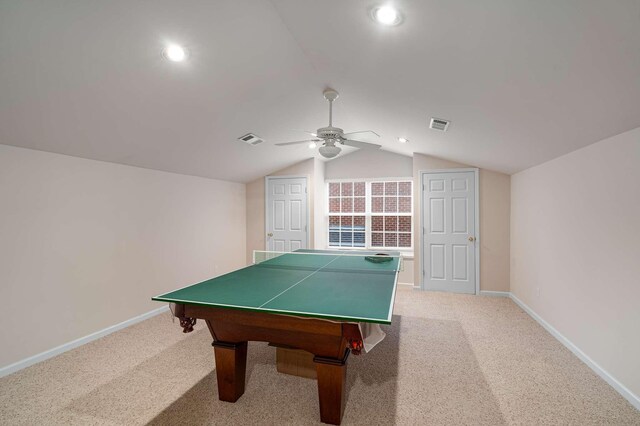 rec room featuring lofted ceiling, light colored carpet, and ceiling fan