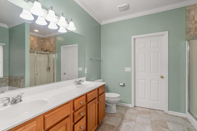 bathroom featuring an enclosed shower, vanity, crown molding, and toilet