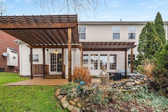 back of house with a yard, a pergola, and a patio