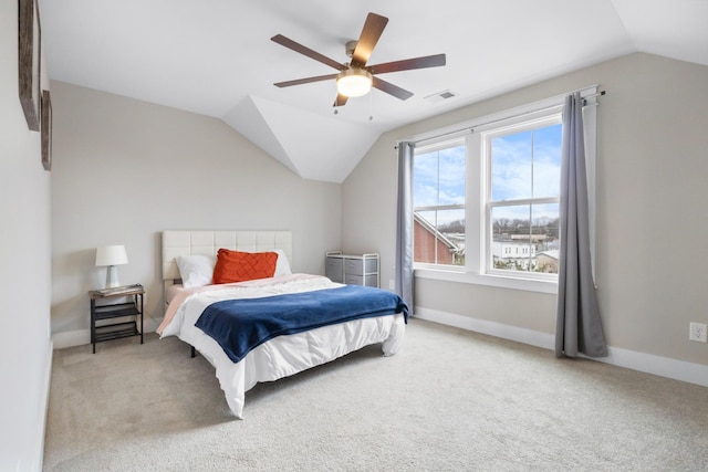 bedroom with lofted ceiling, ceiling fan, and carpet