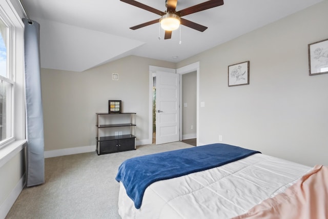 carpeted bedroom with lofted ceiling and ceiling fan