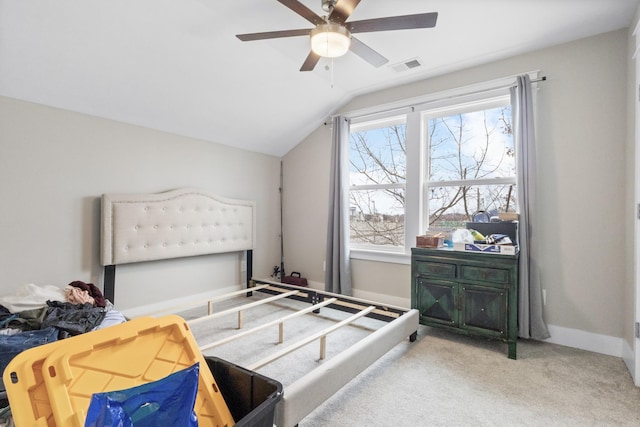 bedroom featuring lofted ceiling, carpet floors, and ceiling fan