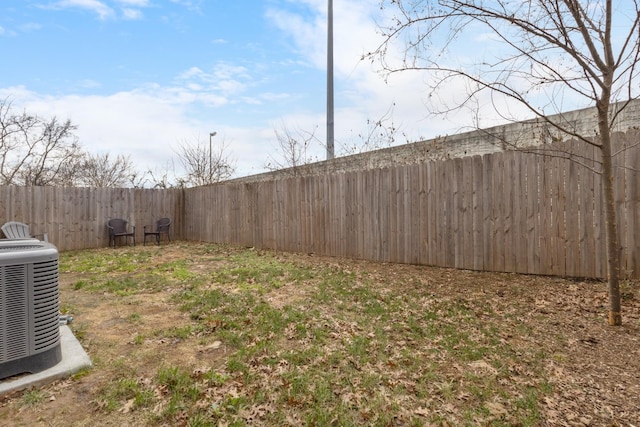 view of yard with central AC unit