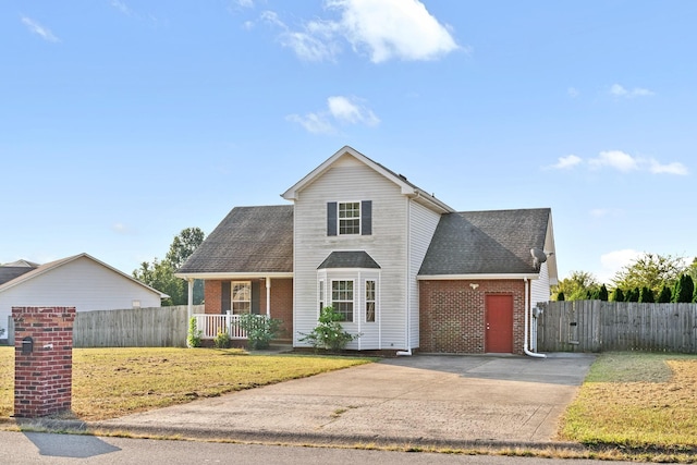 front facade with a porch and a front yard