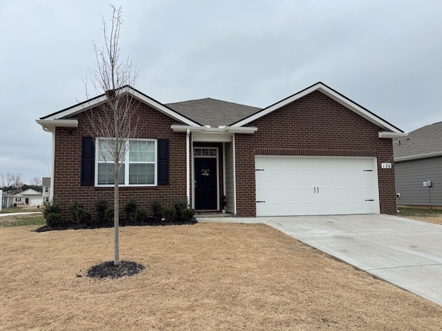 view of front of home featuring a garage and a front yard