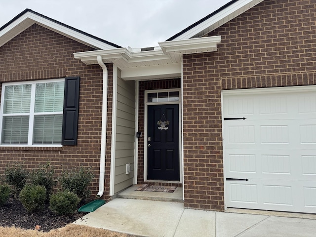 entrance to property featuring a garage