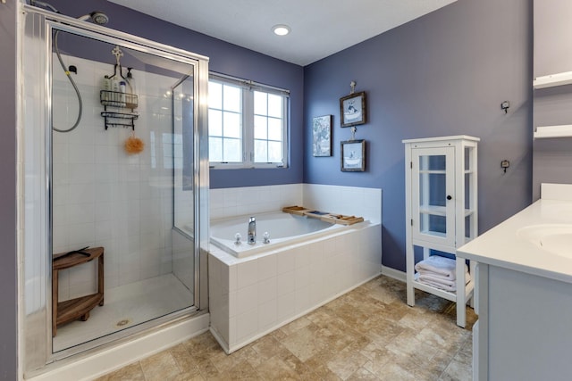 bathroom featuring plus walk in shower and vanity