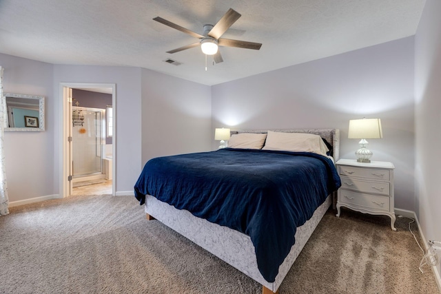 carpeted bedroom with ceiling fan and ensuite bathroom