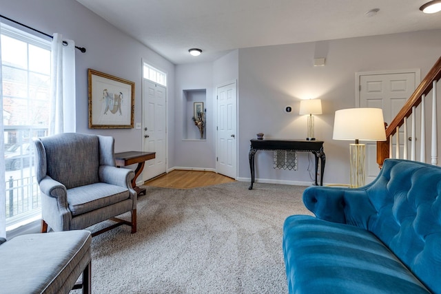 sitting room featuring light colored carpet