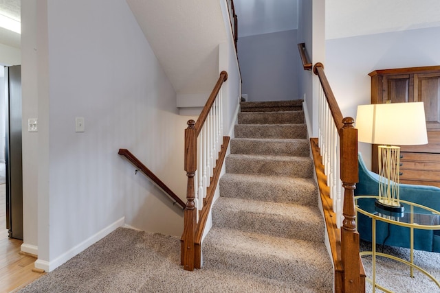 stairs with carpet flooring