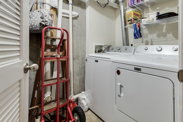 laundry area featuring washing machine and clothes dryer