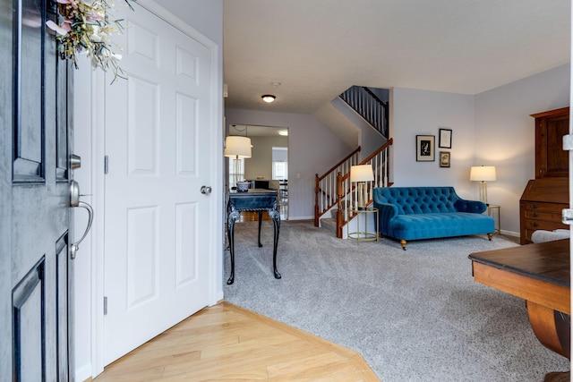 view of carpeted entrance foyer