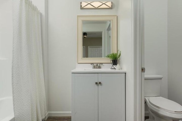 bathroom featuring vanity and toilet