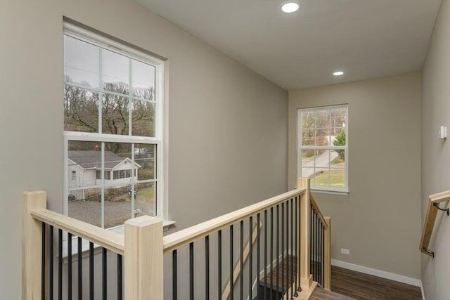 corridor with hardwood / wood-style floors