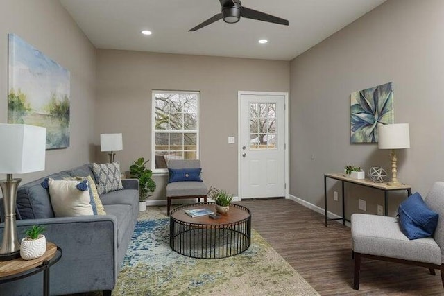 living room with ceiling fan and dark hardwood / wood-style floors