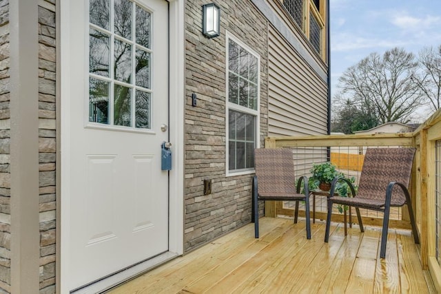 property entrance with a deck