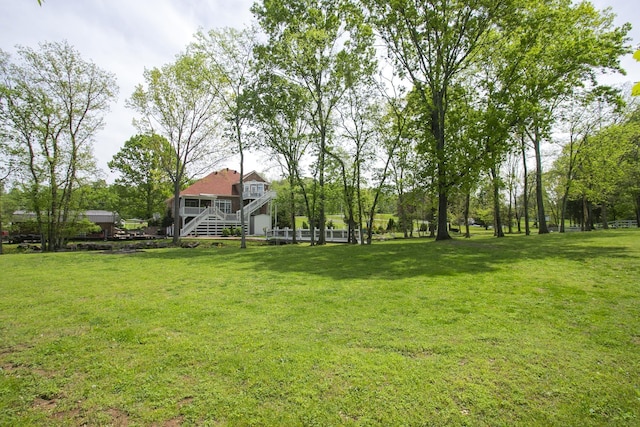 view of yard featuring stairs