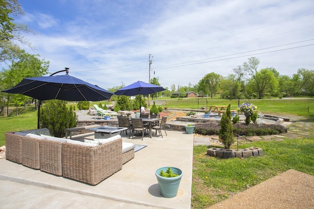 view of patio / terrace with outdoor lounge area, a garden, and outdoor dining space