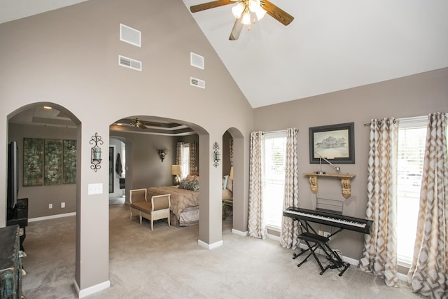 living area featuring baseboards, a ceiling fan, carpet flooring, and visible vents