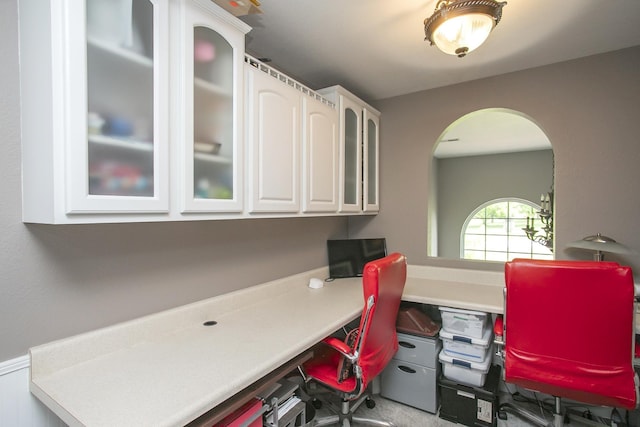 home office featuring arched walkways