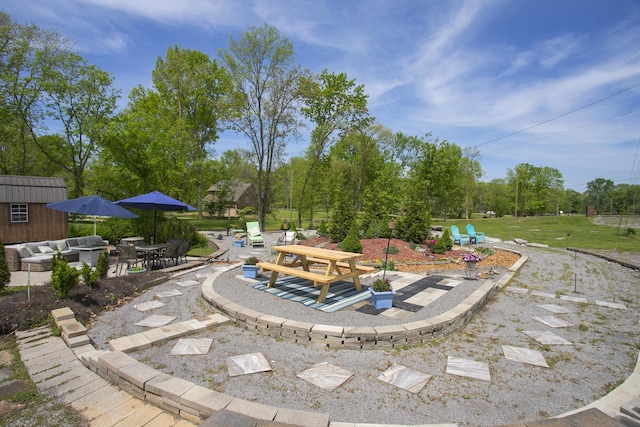 view of yard with a patio, an outbuilding, and outdoor lounge area