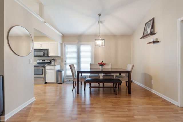 dining area with light hardwood / wood-style flooring