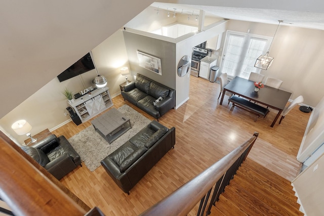 living room featuring hardwood / wood-style flooring and lofted ceiling