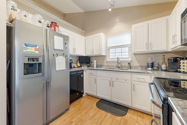 kitchen with light wood-type flooring, white cabinets, sink, and black appliances