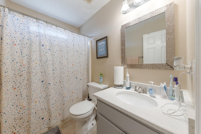 bathroom featuring tile patterned flooring, vanity, curtained shower, and toilet