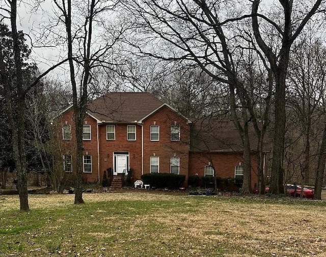 view of front of home with a front lawn