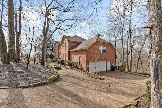 view of side of home with a garage