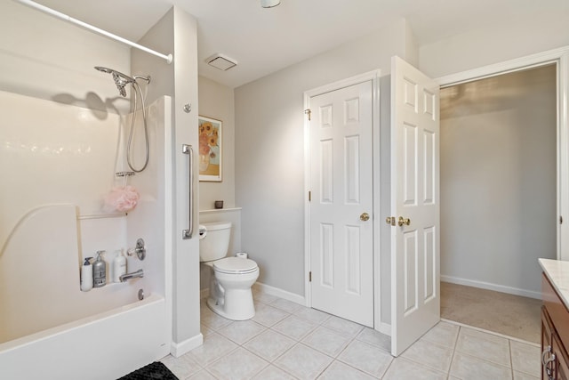 full bathroom with bathing tub / shower combination, toilet, vanity, and tile patterned floors