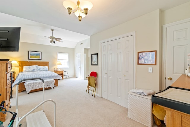 bedroom with light carpet, vaulted ceiling, and ceiling fan