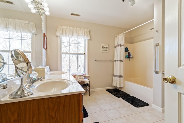 bathroom with a healthy amount of sunlight, shower / bathtub combination with curtain, tile patterned flooring, and vanity