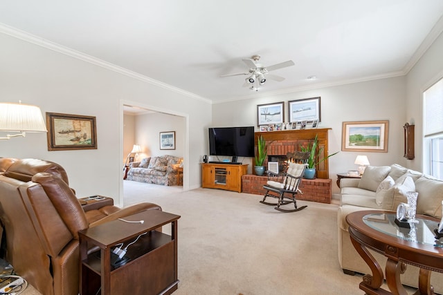 carpeted living room with a fireplace, ornamental molding, and ceiling fan