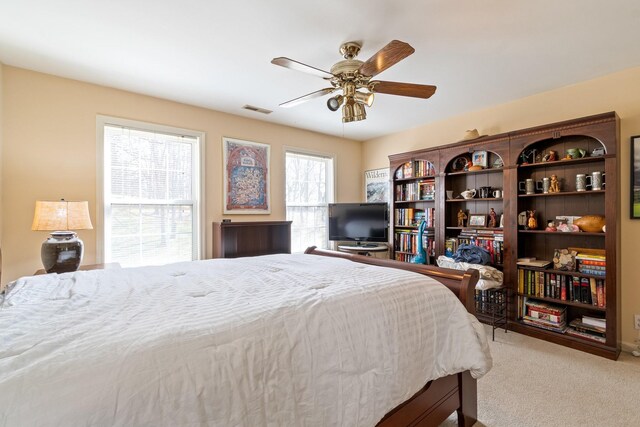 bedroom featuring ceiling fan and carpet floors