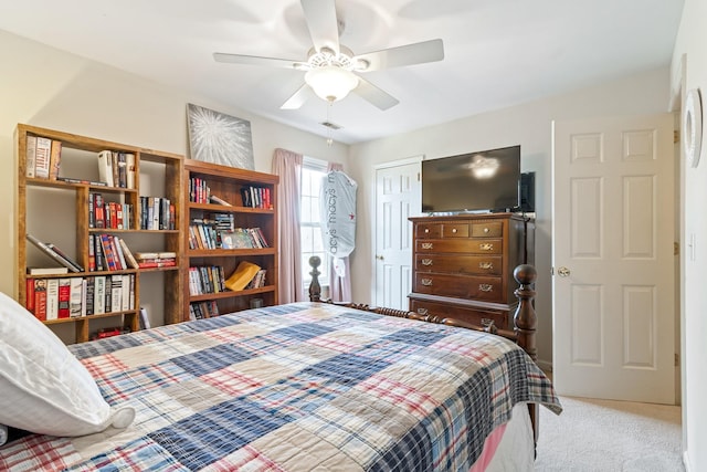 carpeted bedroom featuring a closet and ceiling fan