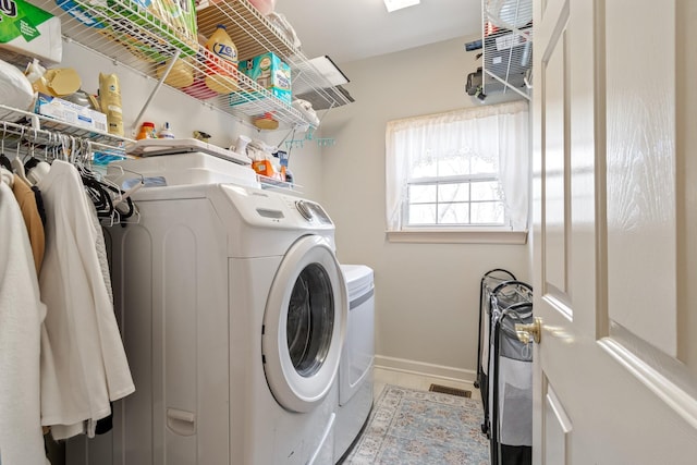 washroom featuring washer and clothes dryer