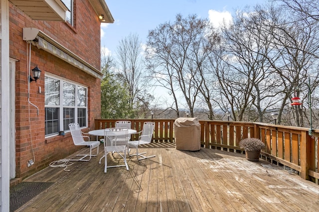 wooden deck featuring area for grilling