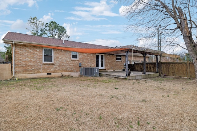 rear view of house with a yard, central AC, and a patio