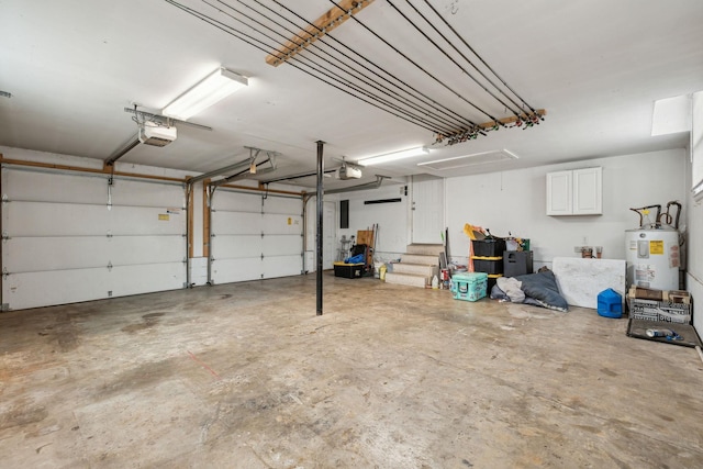 garage with a garage door opener and water heater