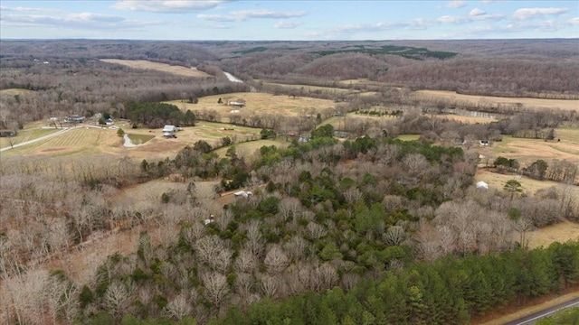 birds eye view of property featuring a rural view