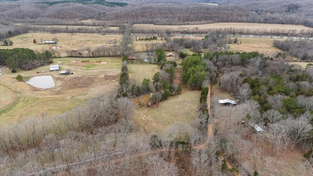 birds eye view of property with a rural view